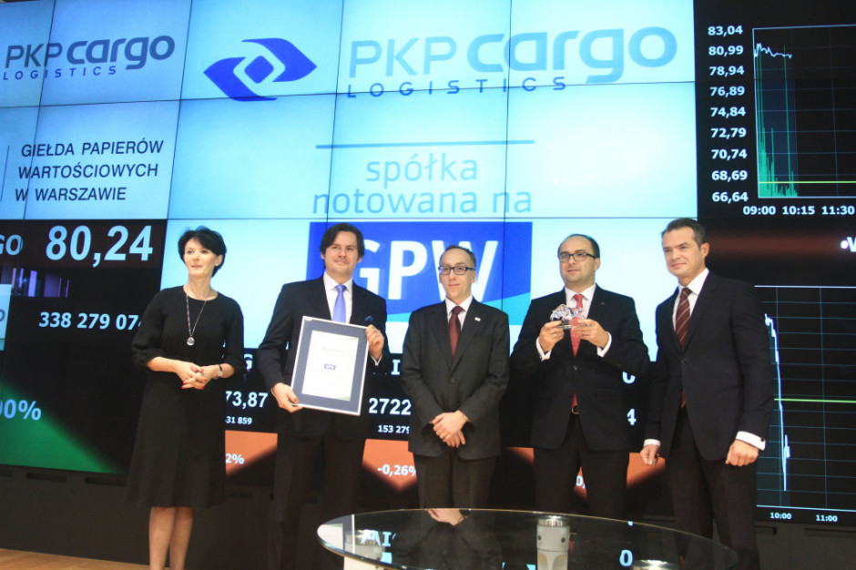 Od lewej: Beata Jarosz - wiceprezes GPW, Adam Purwin - członek zarządu ds. finansowych PKP Cargo, Jakub Karnowski - prezes Grupy PKP, Łukasz Boroń - prezes PKP Cargo, minister  transportu Sławomir Nowak.