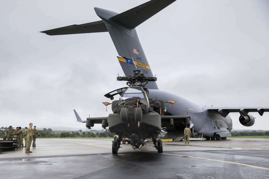 An AH-64 helicopter awaiting loading onto a C-17 transport aircraft. Photo: Thomas Mort/DVIDSHUB